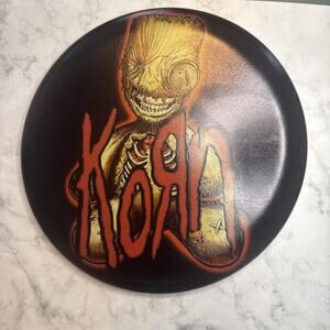 custom-dyed disc golf disc featuring the logo and character from the band Korn